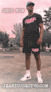 a man wearing a t shirt and shorts with the words shop now
